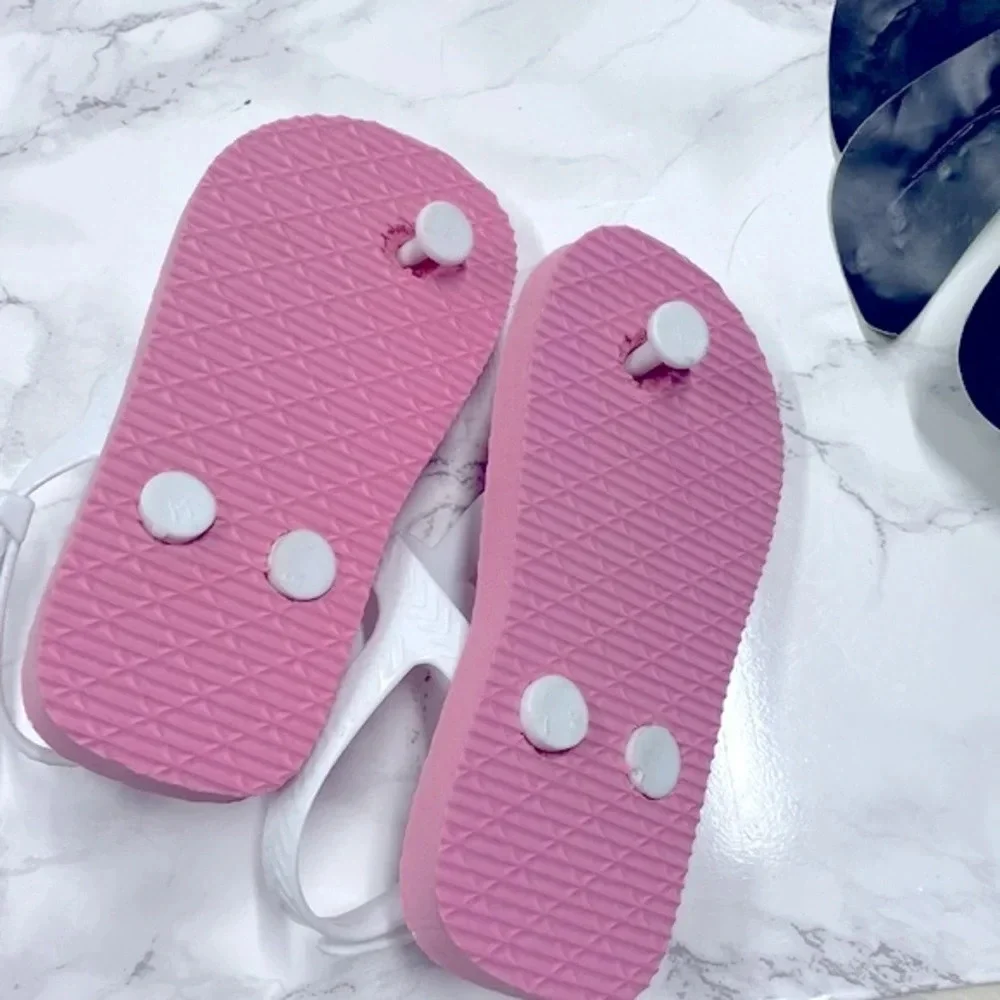 Girls pink polka dot flip flops size 7